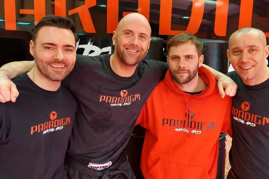 The Paradigm Martial Arts coaching team in the gym